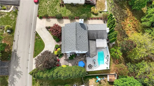 an aerial view of a house with a garden