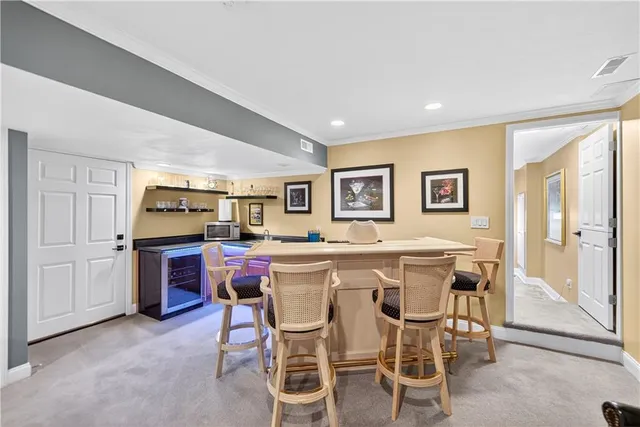 a kitchen with a table and chairs in it