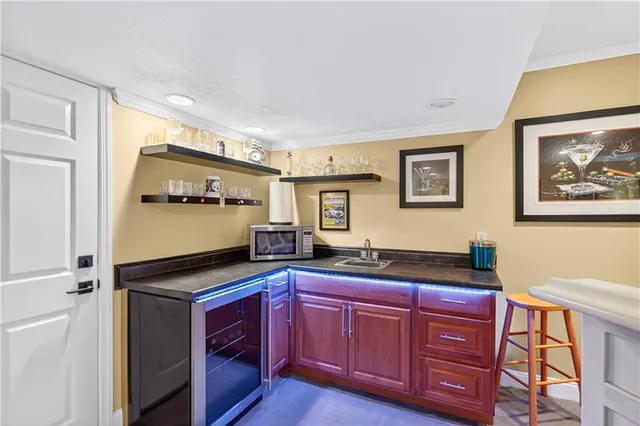 a kitchen with granite countertop cabinets and stainless steel appliances