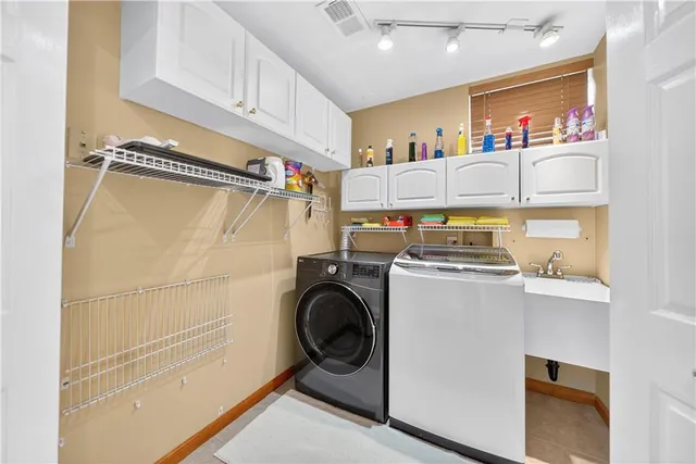 a utility room with dryer and washer
