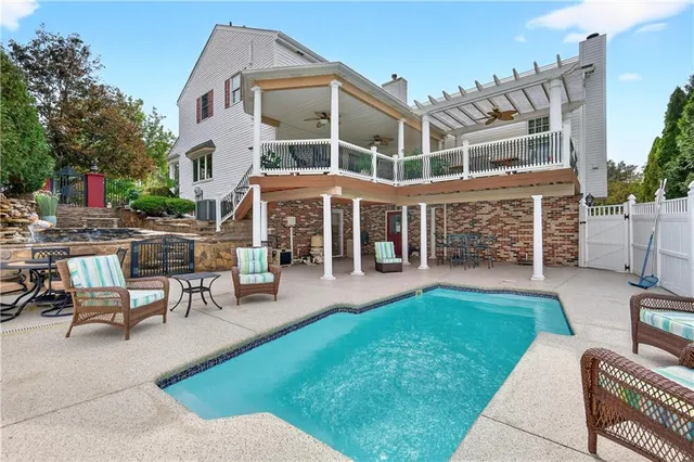 a view of a house with a backyard