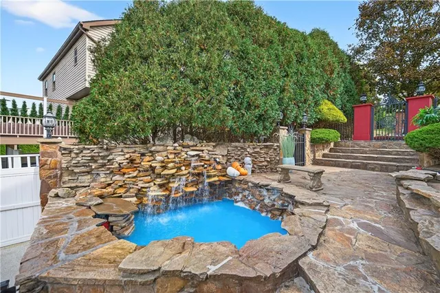 a view of swimming pool with lounge chair