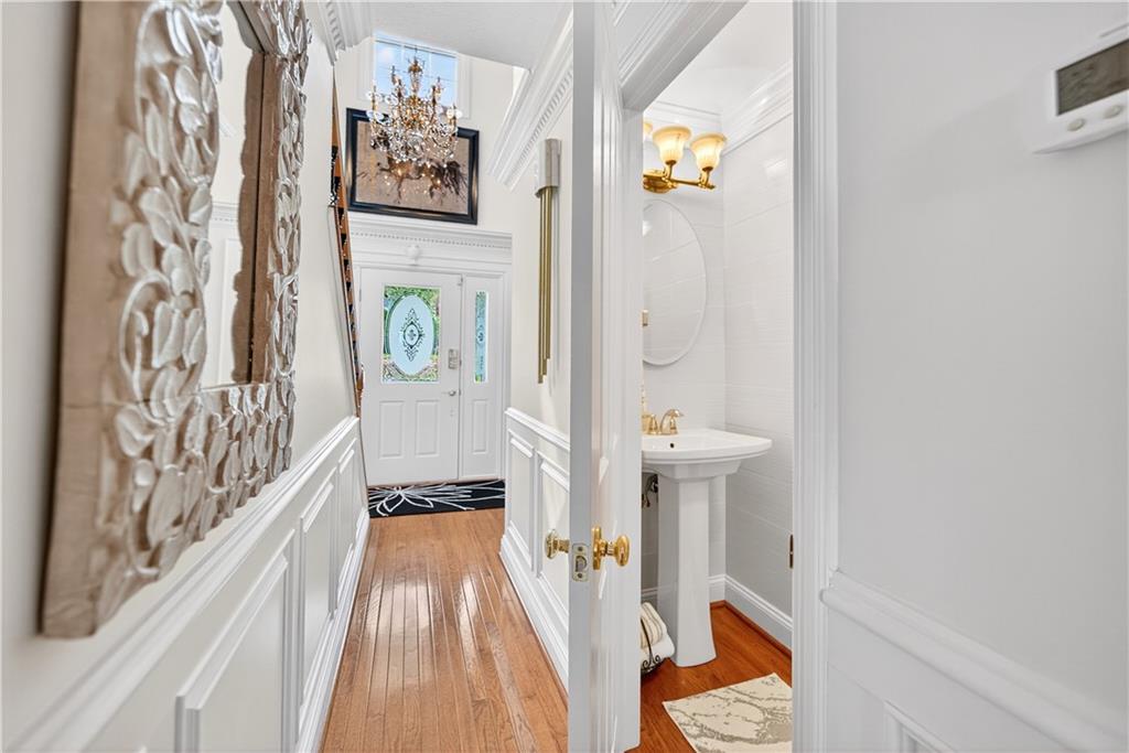 Tile surround half bath in the hall entry area of the home
