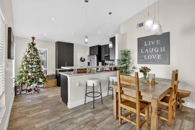 a kitchen with stainless steel appliances a refrigerator sink and microwave