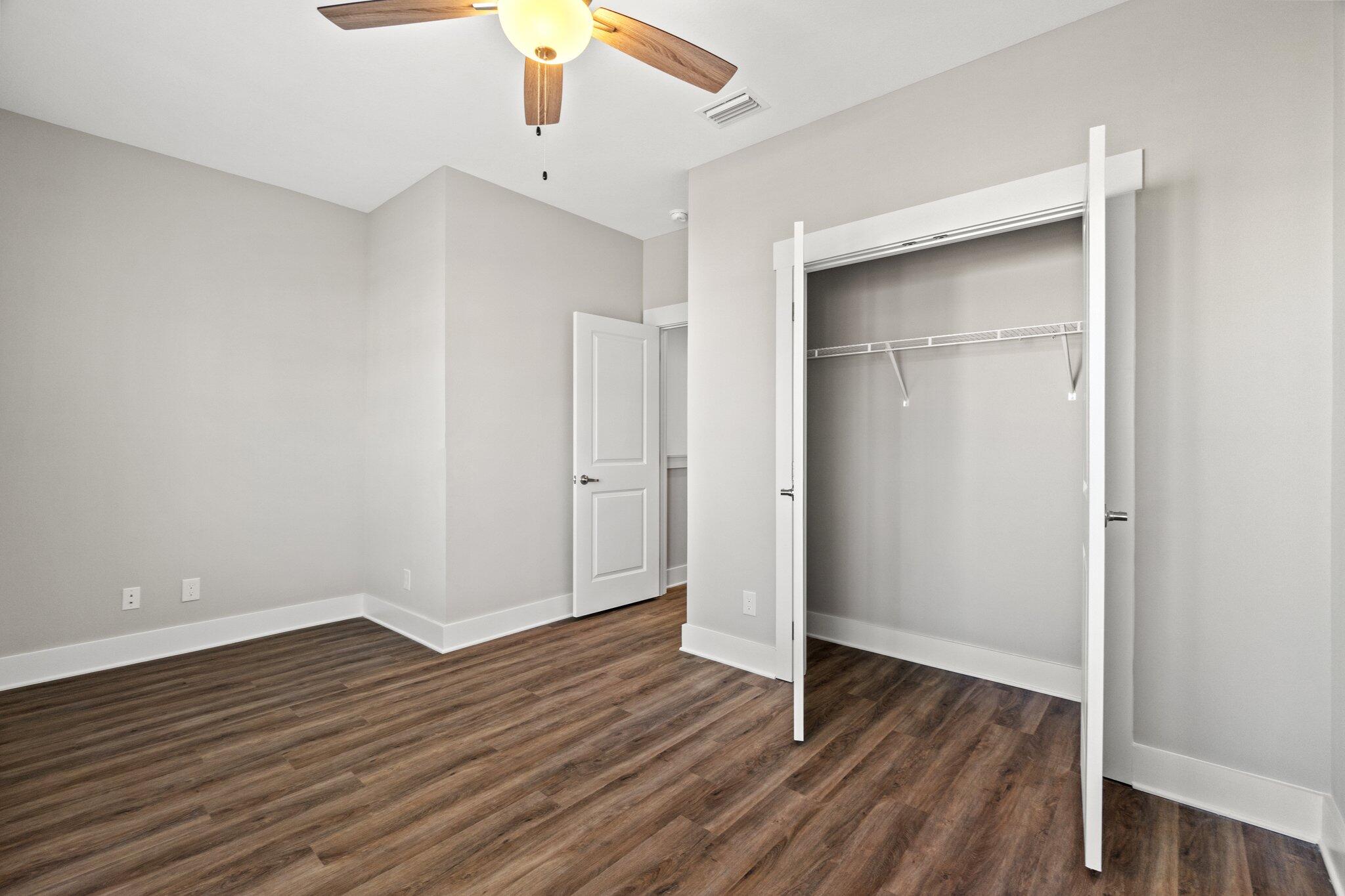 274 Date Palm Lane, Unit HORIZON Freeport, FL 32439 - Photo 18 of 28 an empty room with wooden floor & entryway