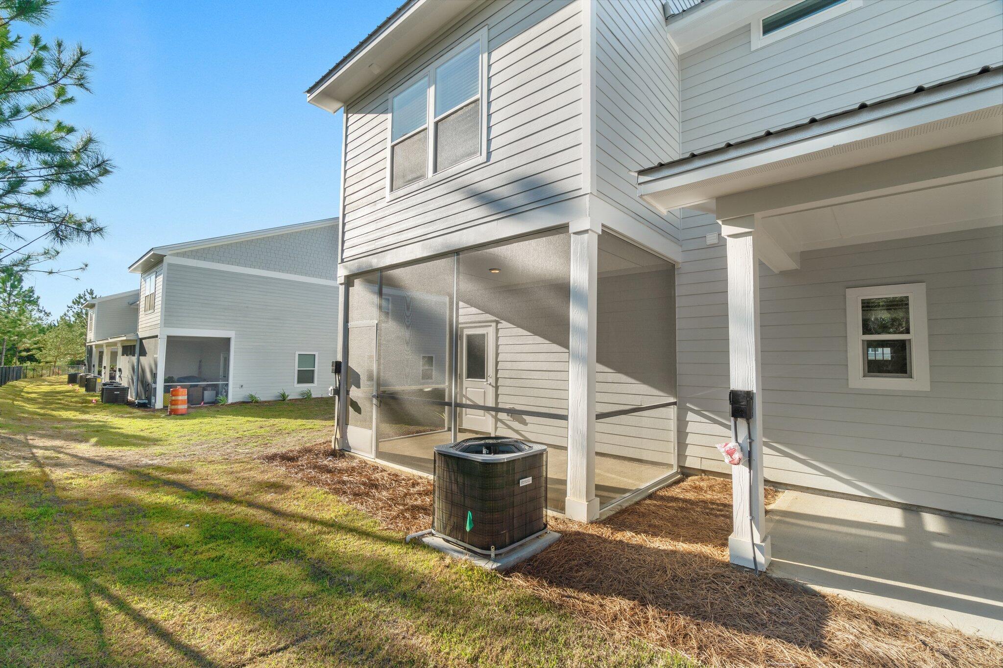 274 Date Palm Lane, Unit HORIZON Freeport, FL 32439 - Photo 24 of 28 a view of a house with backyard