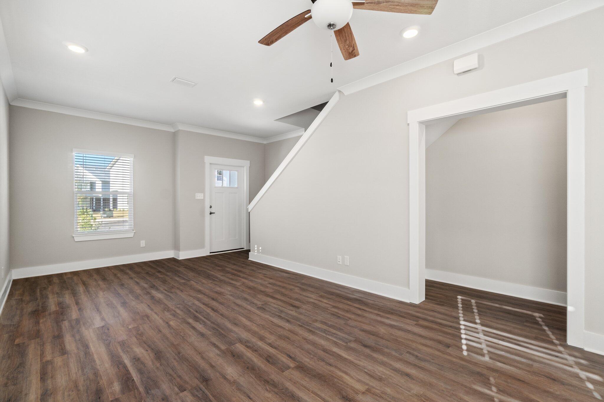 274 Date Palm Lane, Unit HORIZON Freeport, FL 32439 - Photo 6 of 28 wooden floor in an empty room with a window
