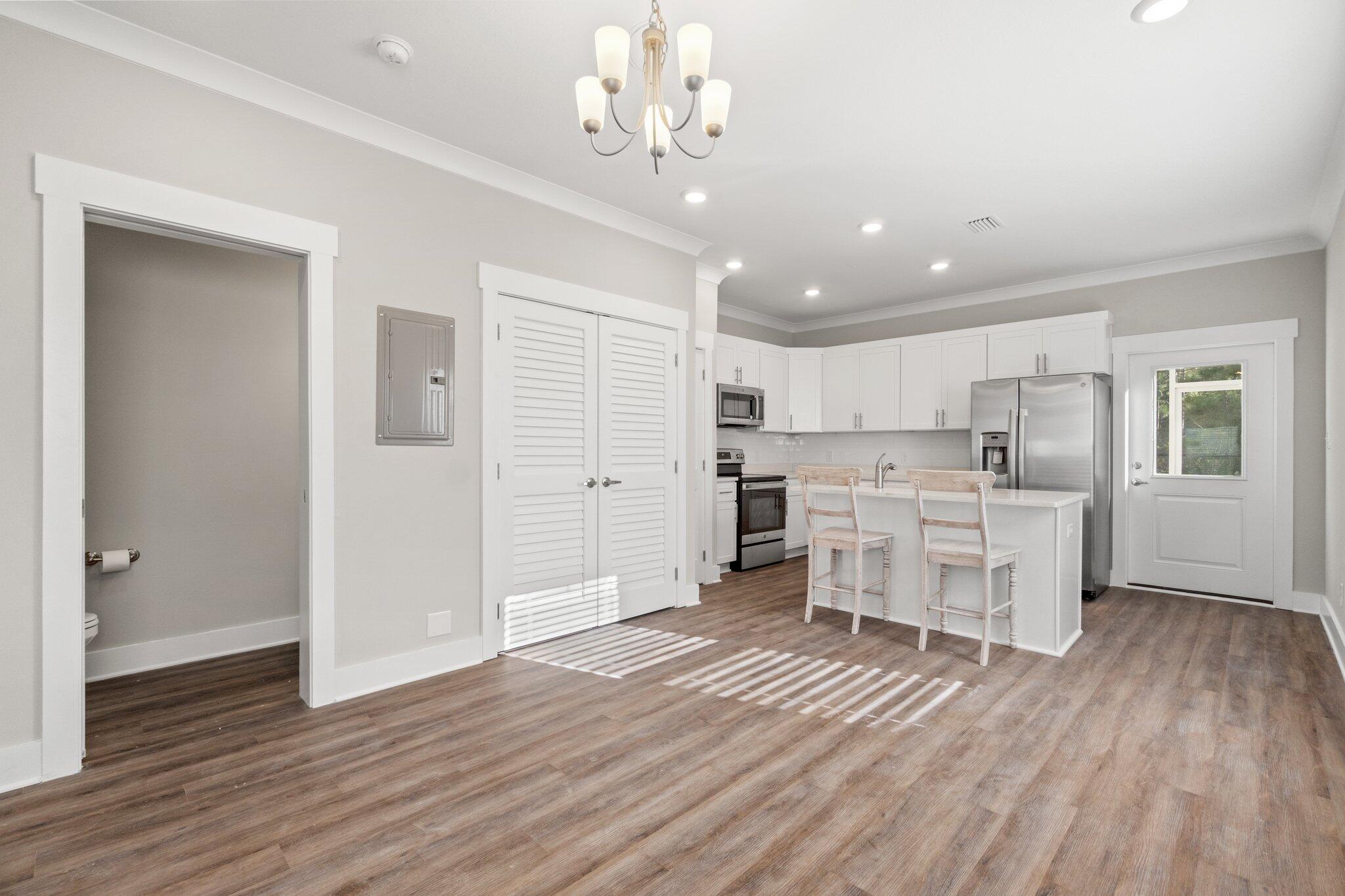 274 Date Palm Lane, Unit HORIZON Freeport, FL 32439 - Photo 7 of 28 a view of kitchen with sink microwave and cabinets
