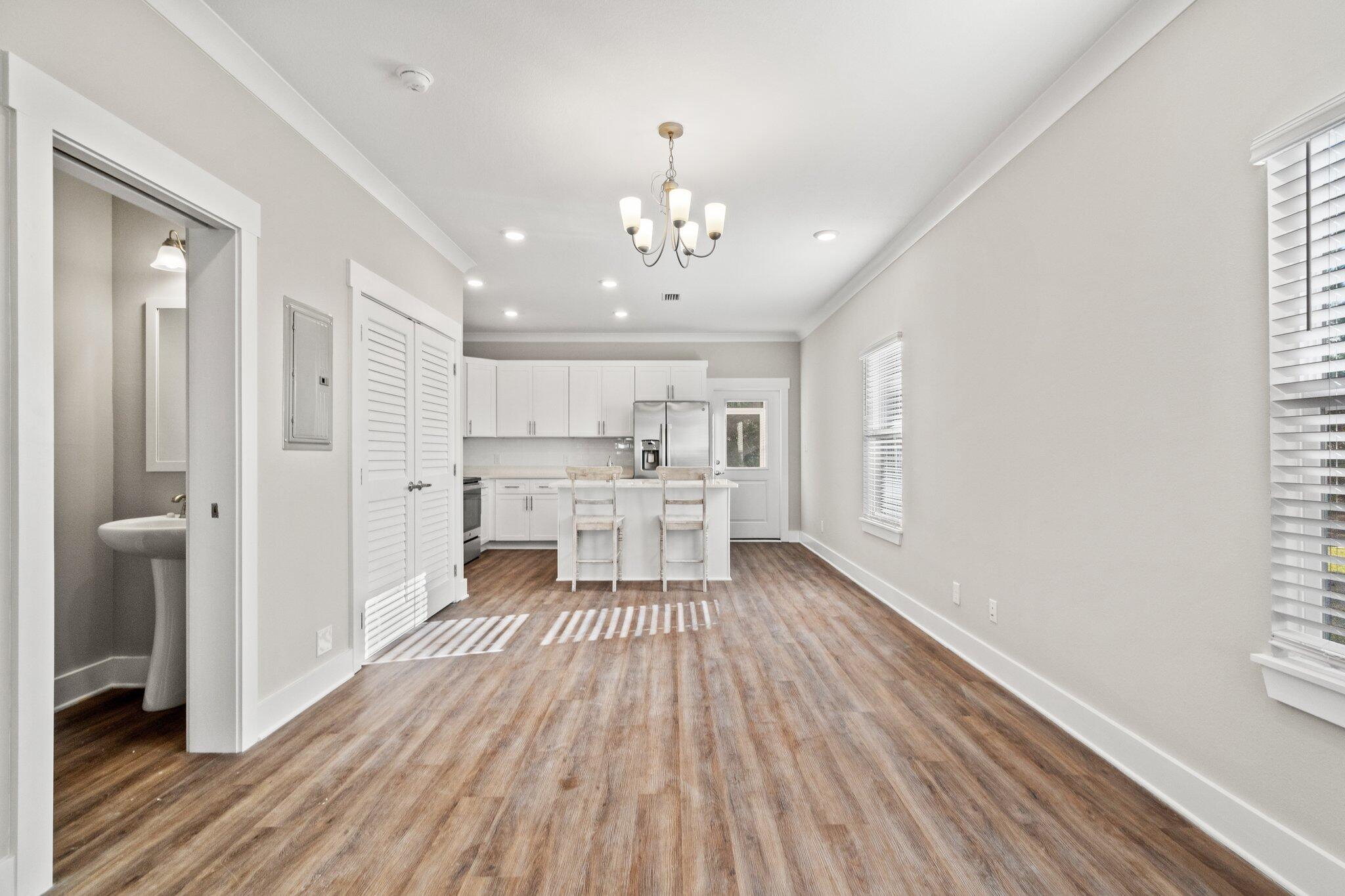 274 Date Palm Lane, Unit HORIZON Freeport, FL 32439 - Photo 8 of 28 a view of a kitchen with wooden floor and a kitchen
