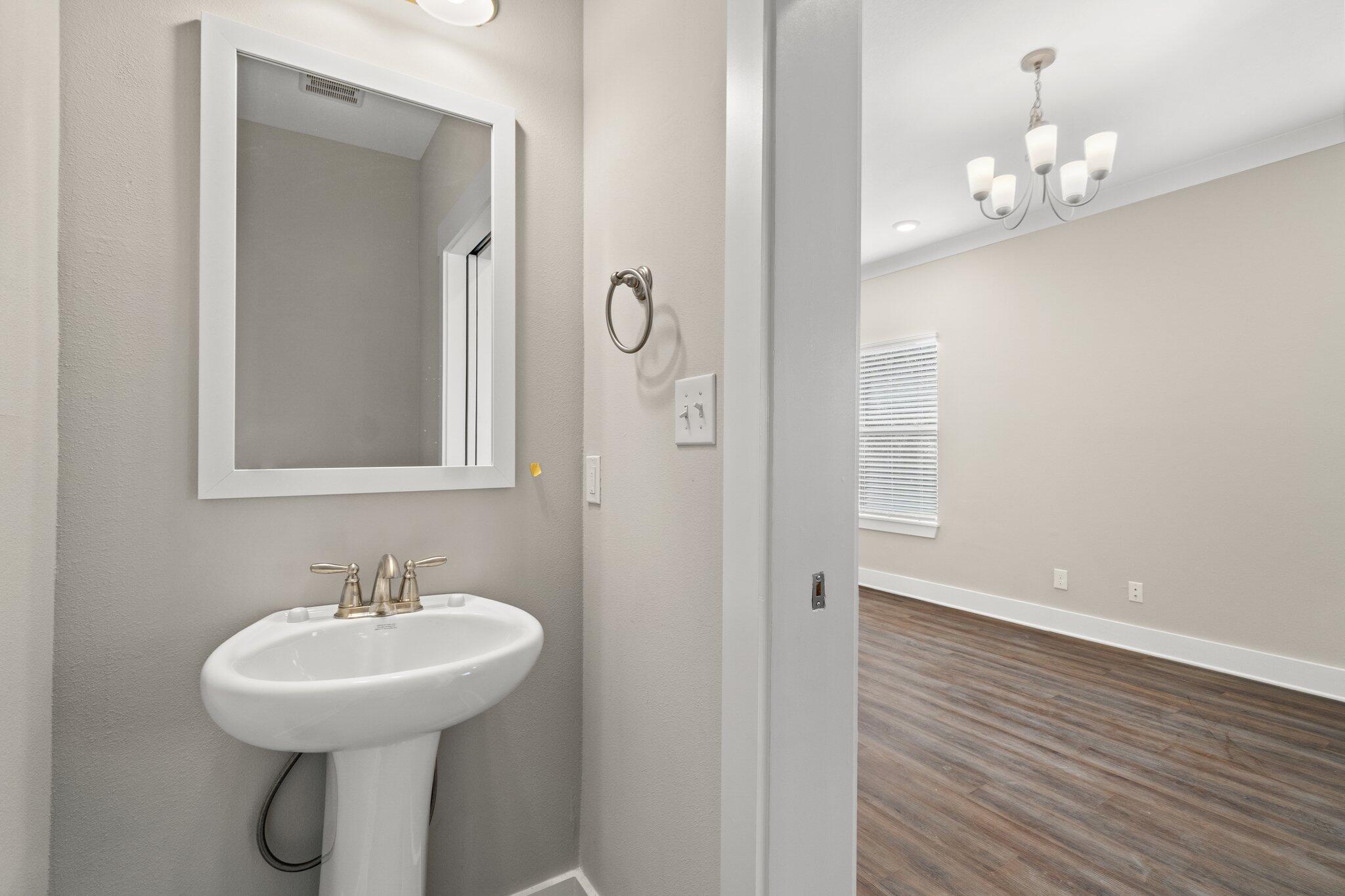 274 Date Palm Lane, Unit HORIZON Freeport, FL 32439 - Photo 9 of 28 a bathroom with a sink a mirror and a shower