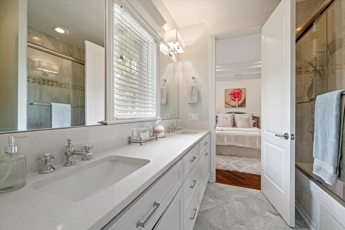 446 Jackson Avenue Glencoe, IL 60022 - Photo 22 of 34 a bathroom with a granite countertop sink and a mirror