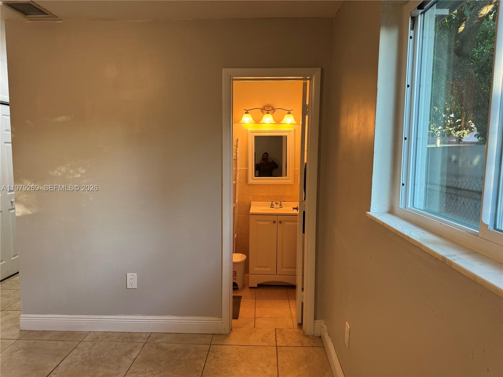 4734 Southwest 4th Street Miami, FL 33134 - Photo 14 of 23 a view of a bathroom with a door