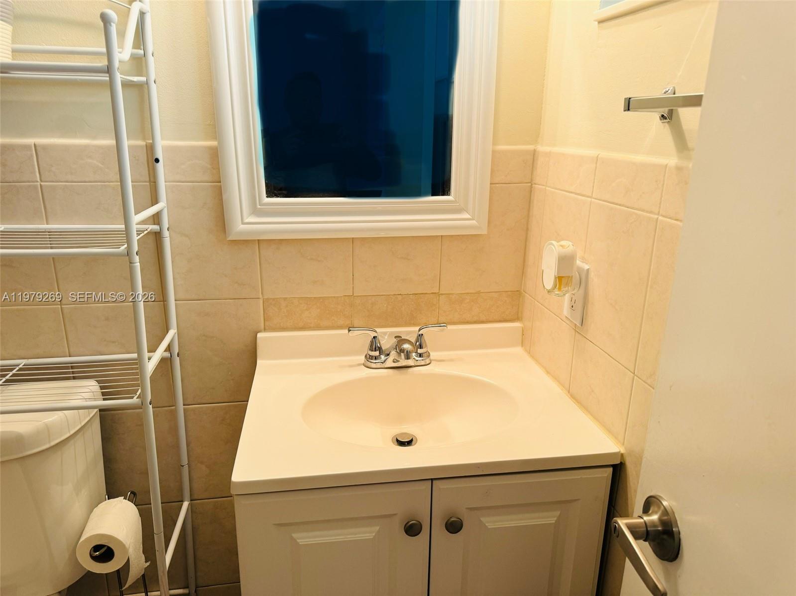 4734 Southwest 4th Street Miami, FL 33134 - Photo 19 of 23 a bathroom with a sink a toilet and shower