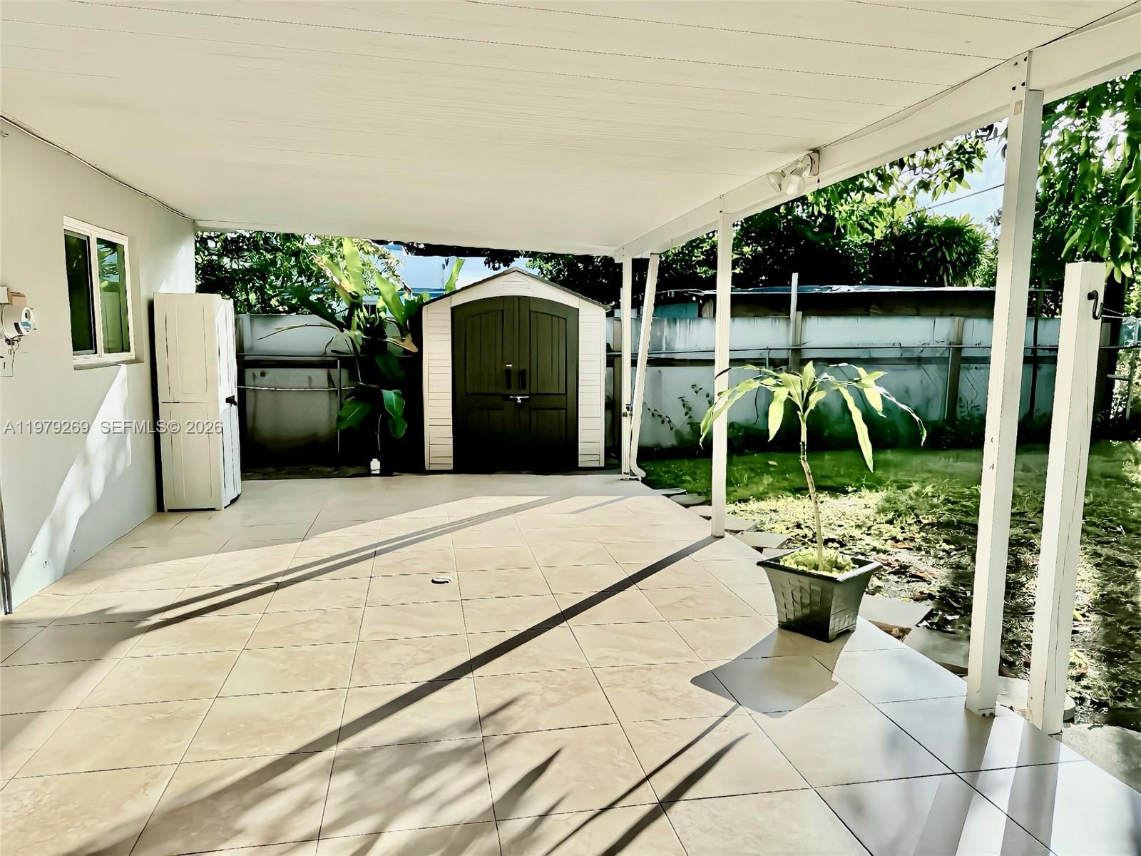 4734 Southwest 4th Street Miami, FL 33134 - Photo 22 of 23 a view of a chair and tables in the patio