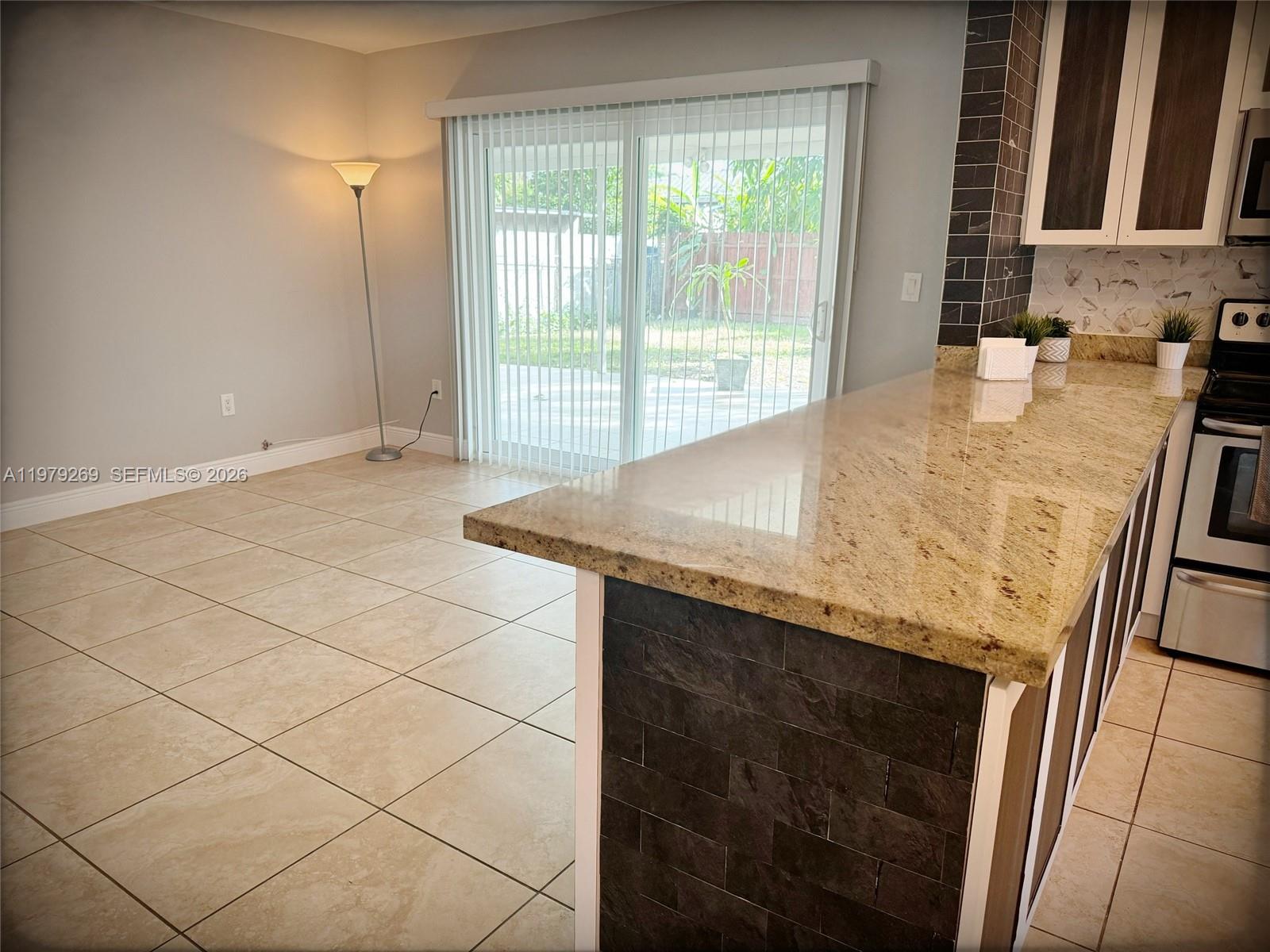 4734 Southwest 4th Street Miami, FL 33134 - Photo 6 of 23 a room with granite countertop sink