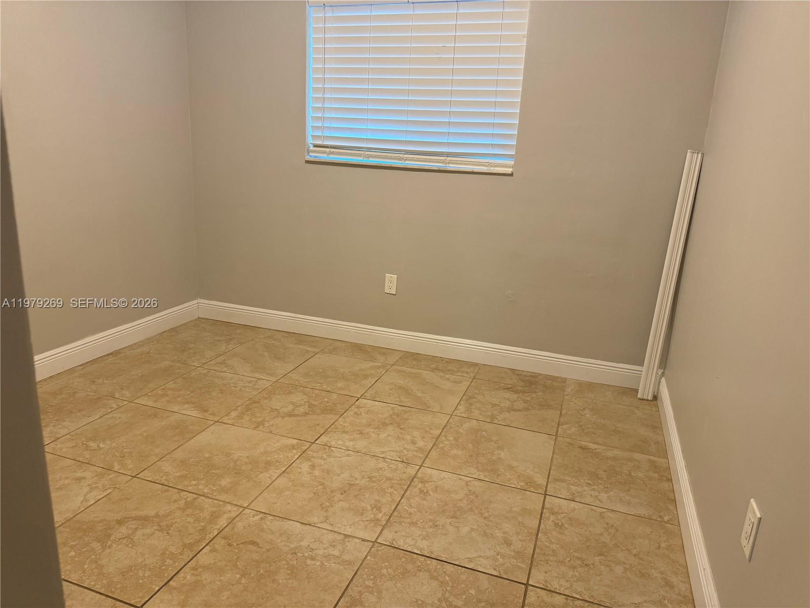 4734 Southwest 4th Street Miami, FL 33134 - Photo 7 of 23 an empty room with a window