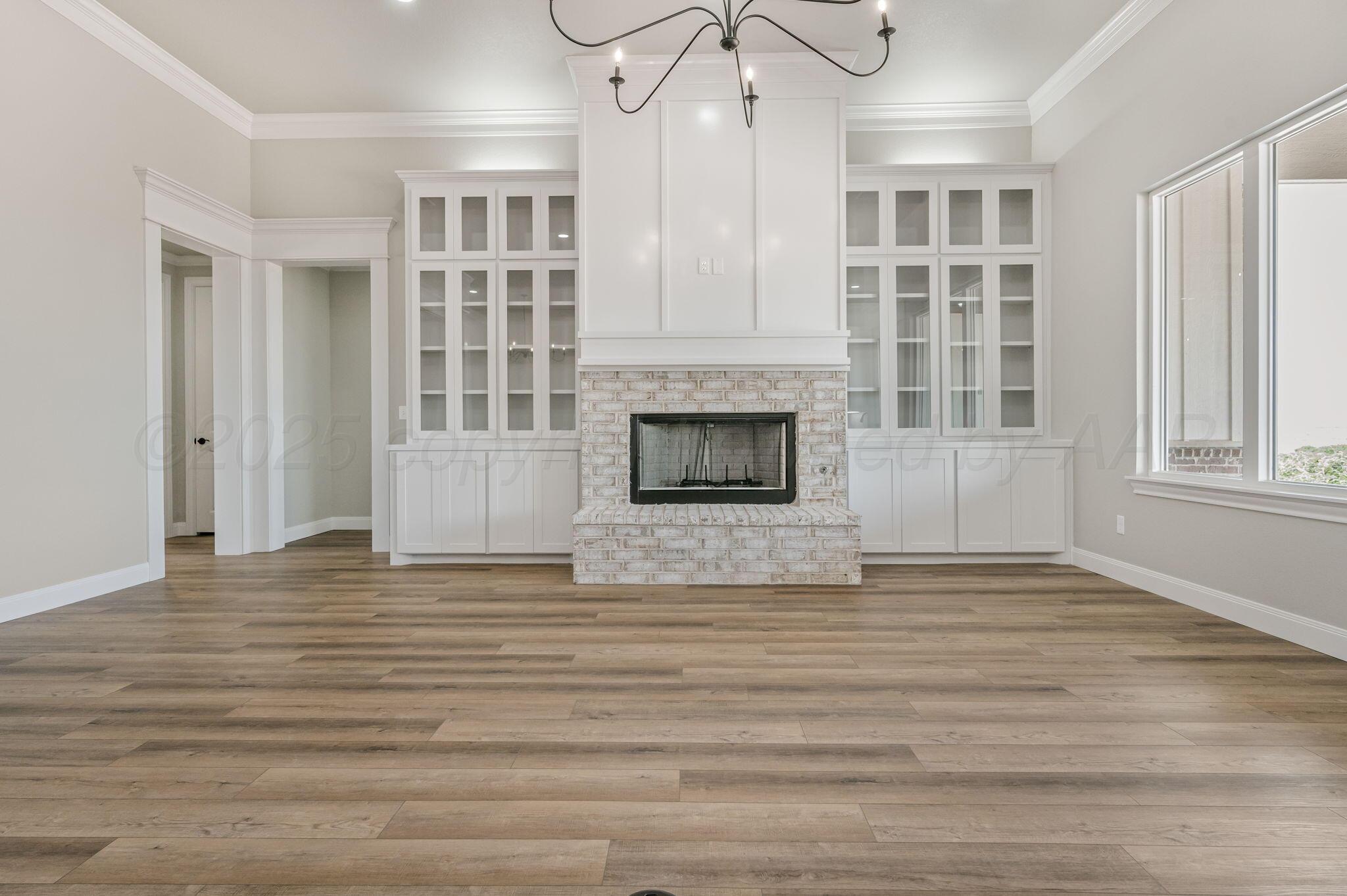 2000 Breken Ridge Road Amarillo, TX 79124 - Photo 8 of 46 Custom Cabinetry Beside Fireplace