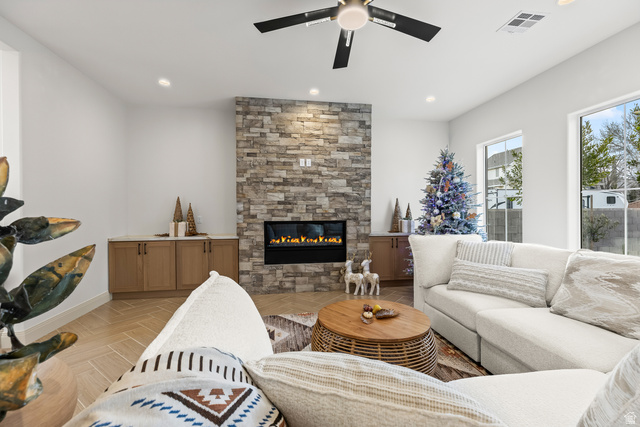 226 East 1100 North Hurricane, UT 84737 - Photo 18 of 49 Living room featuring a ceiling fan, parquet floors, a fireplace, and recessed lighting