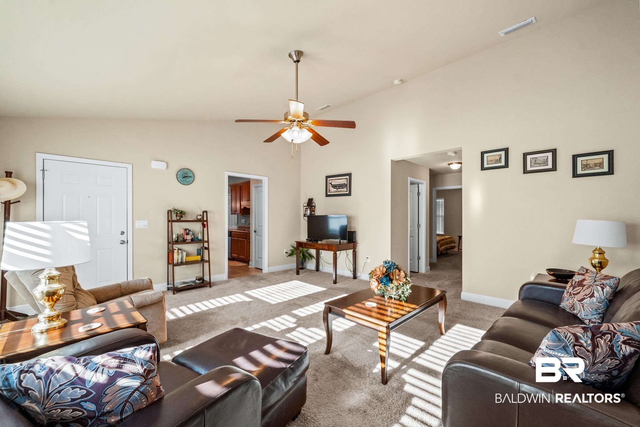 17069 Russet Court Foley, AL 36535 - Photo 7 of 27 Living room featuring ceiling fan, high vaulted ceiling, and light carpet