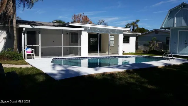 a view of an house with backyard porch and patio