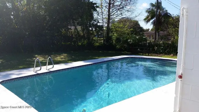 a view of a swimming pool with an outdoor space
