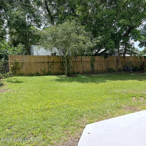 a view of a backyard with a trees