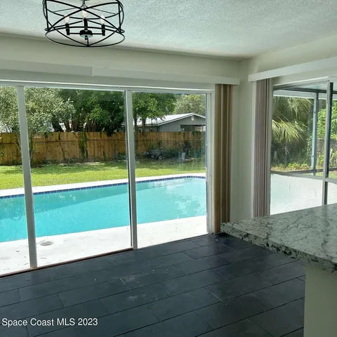 a view of a porch and garden