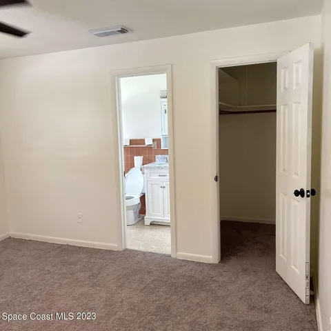 a view of a room with a wardrobe