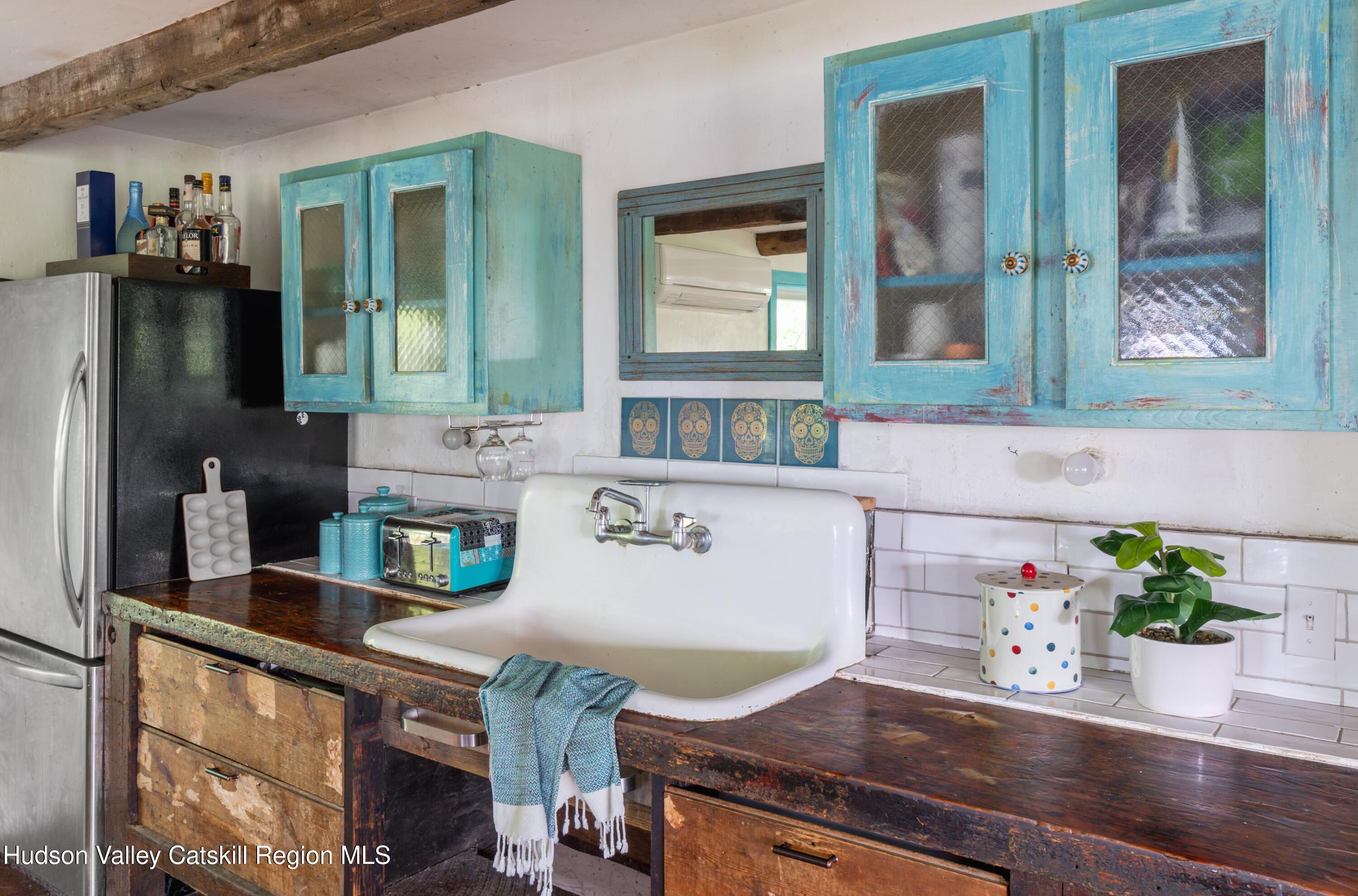 99 Spoorenburgh Road Athens, NY 12015 - Photo 11 of 39 a kitchen with a sink and a potted plant
