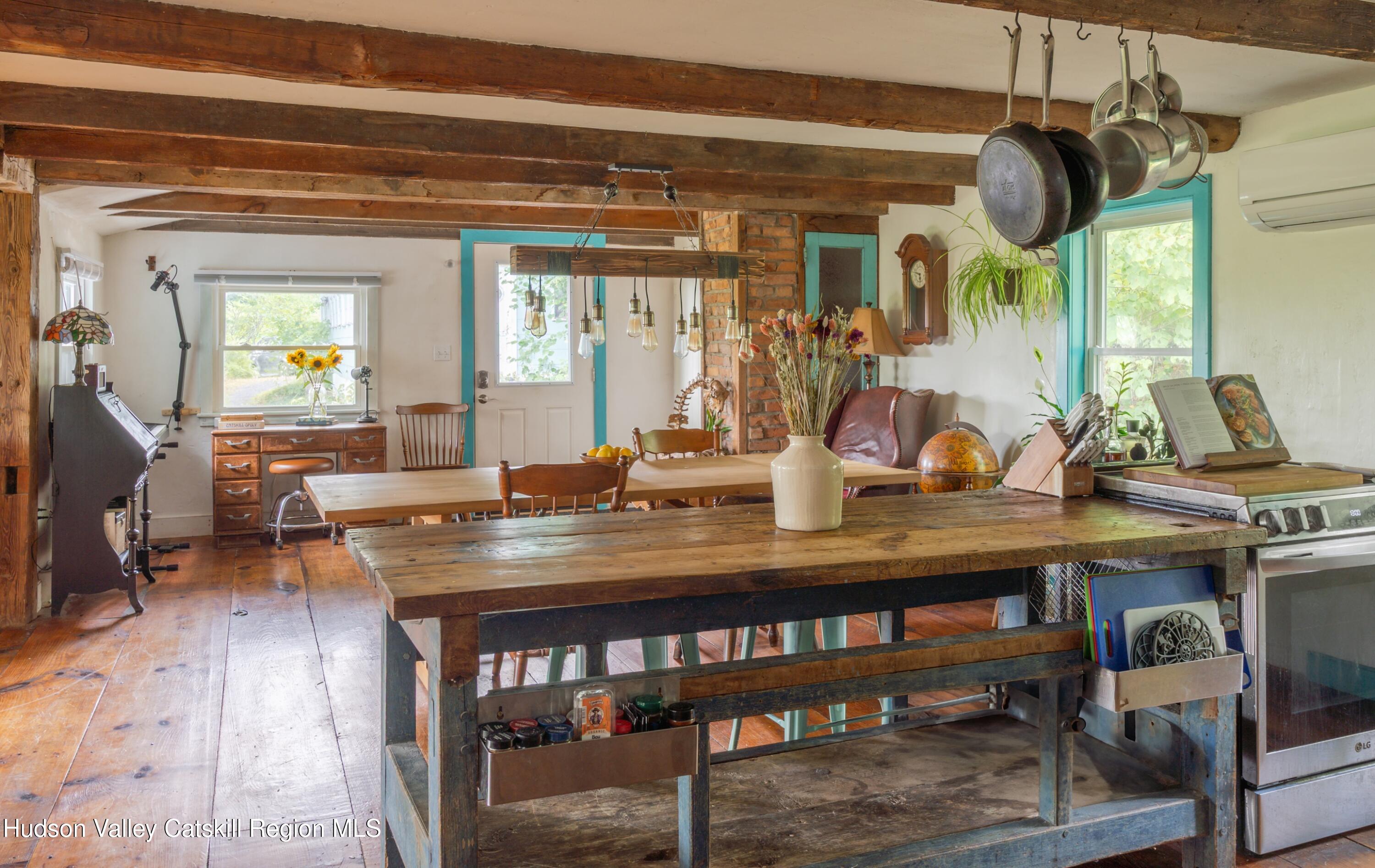 99 Spoorenburgh Road Athens, NY 12015 - Photo 12 of 39 a view of a dining room with a table and chairs