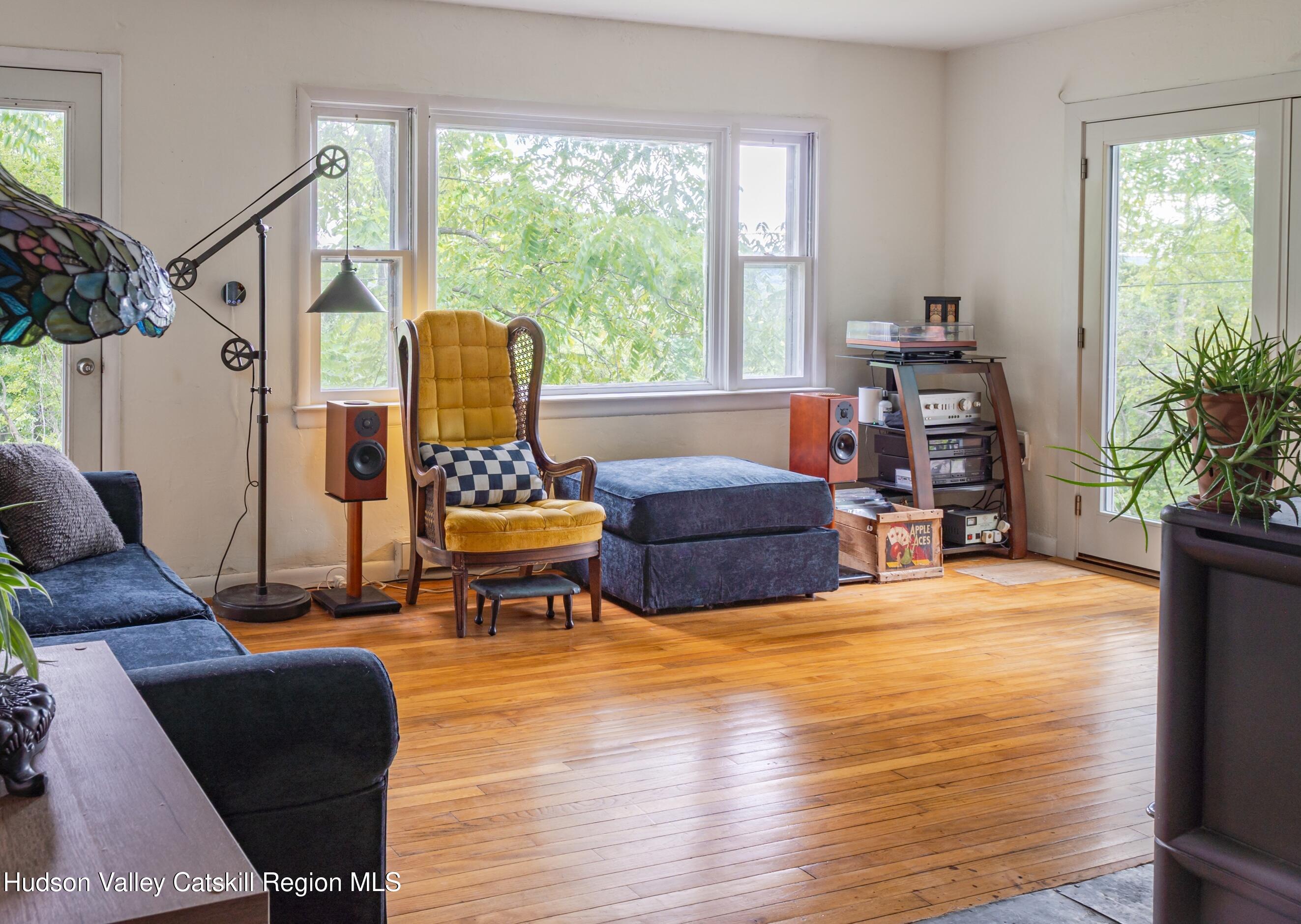 99 Spoorenburgh Road Athens, NY 12015 - Photo 14 of 39 a living room with furniture and a large window