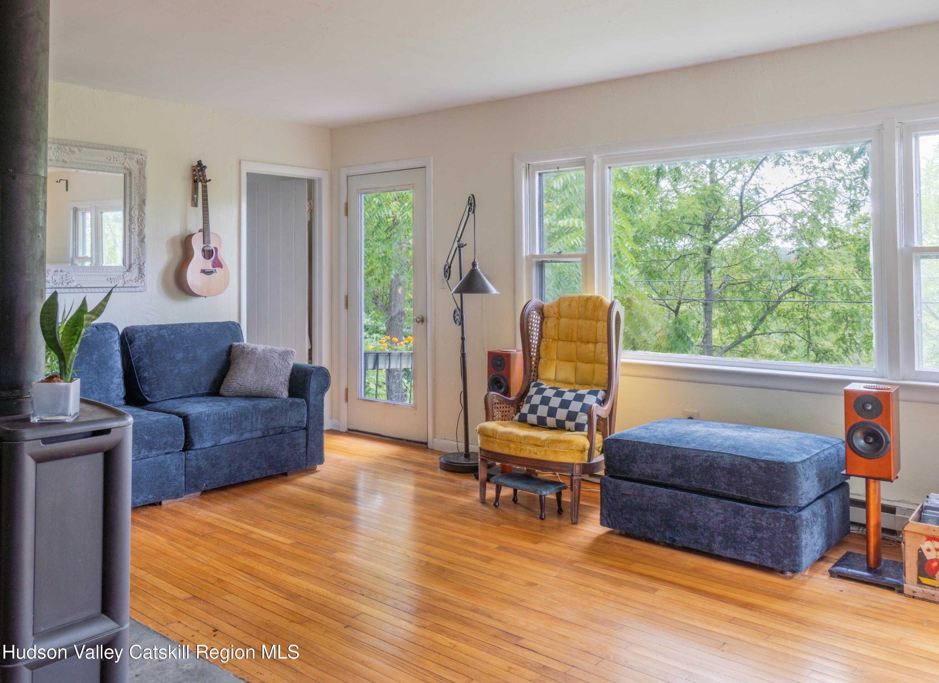 99 Spoorenburgh Road Athens, NY 12015 - Photo 16 of 39 a living room with furniture and a wooden floor