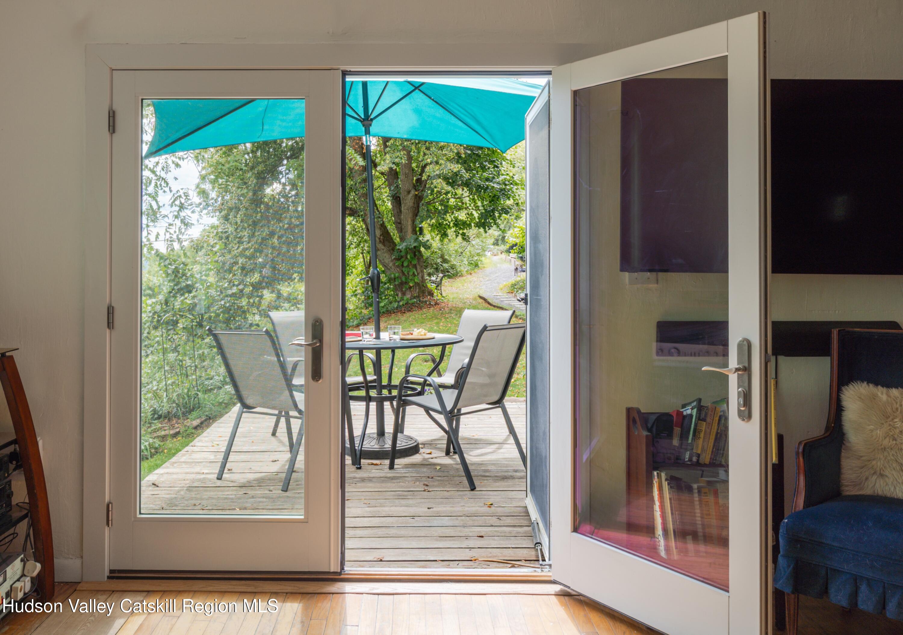 99 Spoorenburgh Road Athens, NY 12015 - Photo 18 of 39 a view of a living room and floor to ceiling window