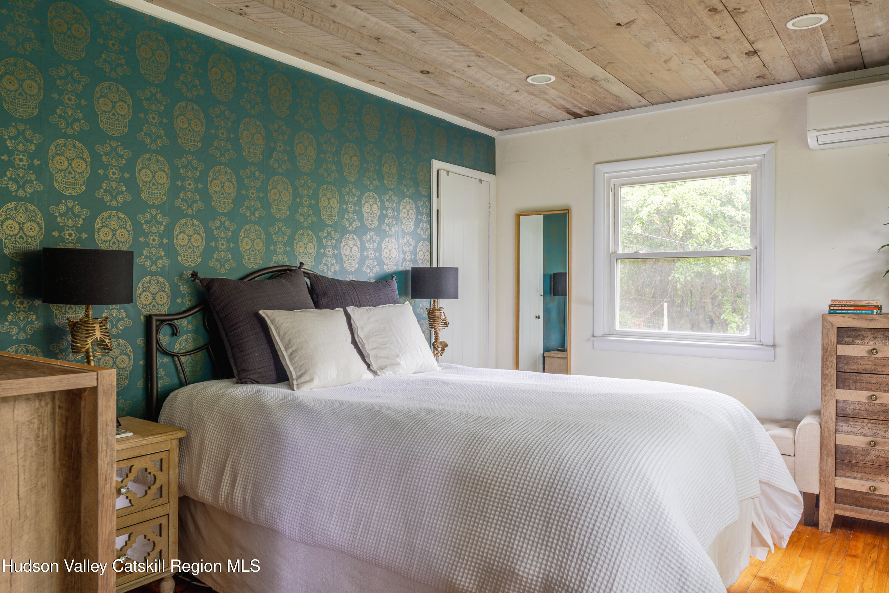 99 Spoorenburgh Road Athens, NY 12015 - Photo 19 of 39 a large bed sitting in a bedroom next to a window