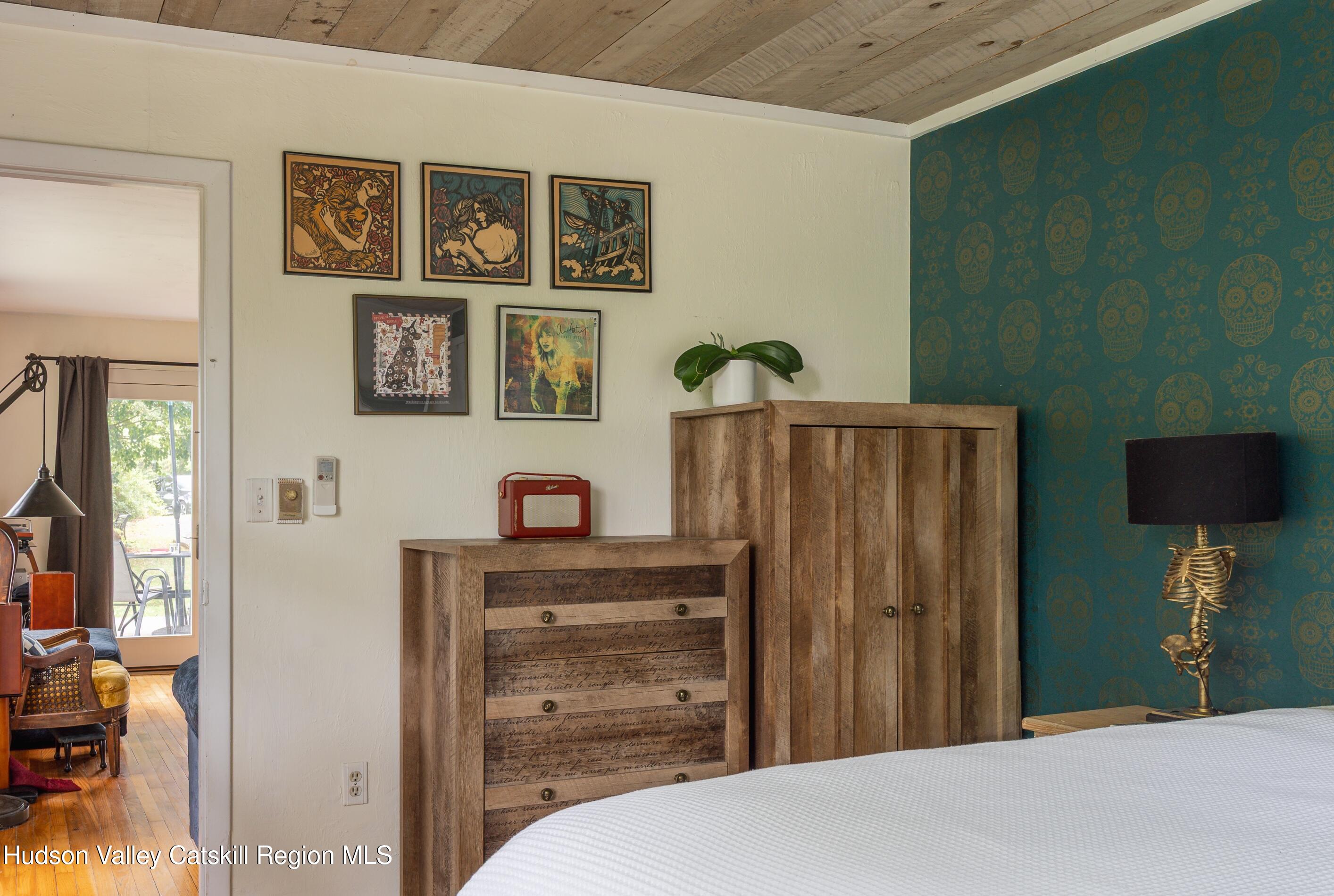 99 Spoorenburgh Road Athens, NY 12015 - Photo 20 of 39 a bedroom with a bed and a cabinet