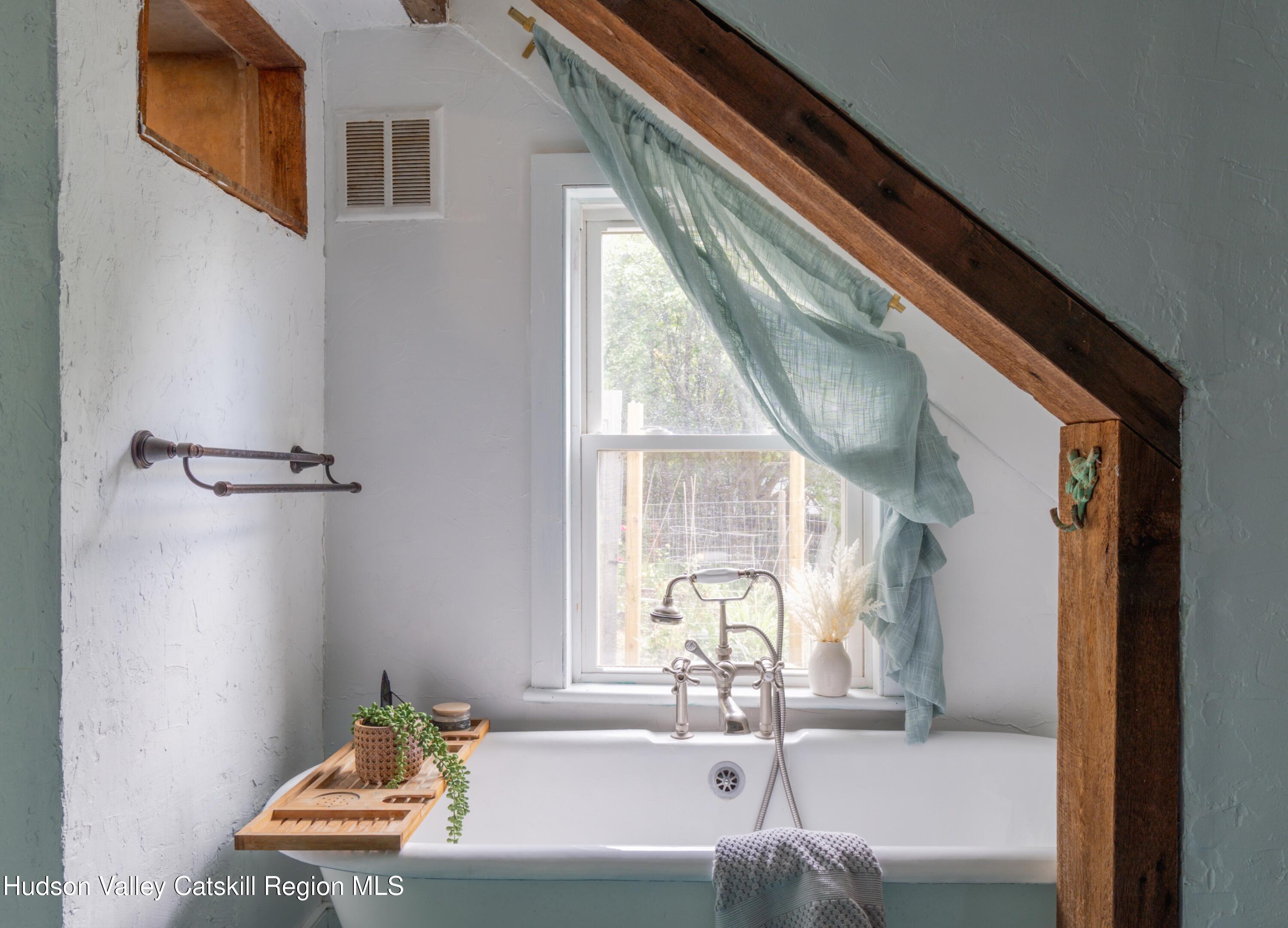 99 Spoorenburgh Road Athens, NY 12015 - Photo 2 of 39 a bath room with a window