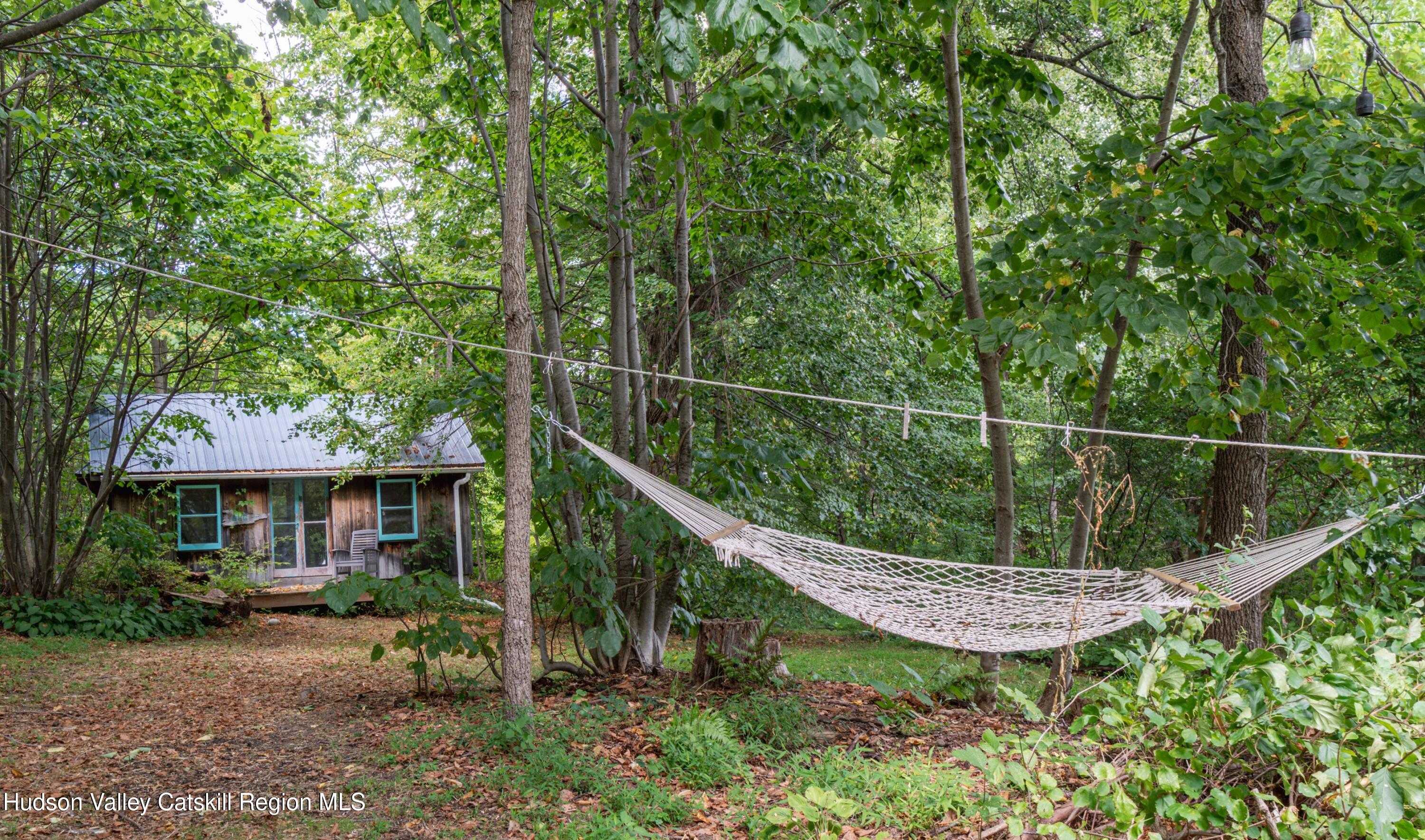 99 Spoorenburgh Road Athens, NY 12015 - Photo 28 of 39 a view of a house with a wooden fence