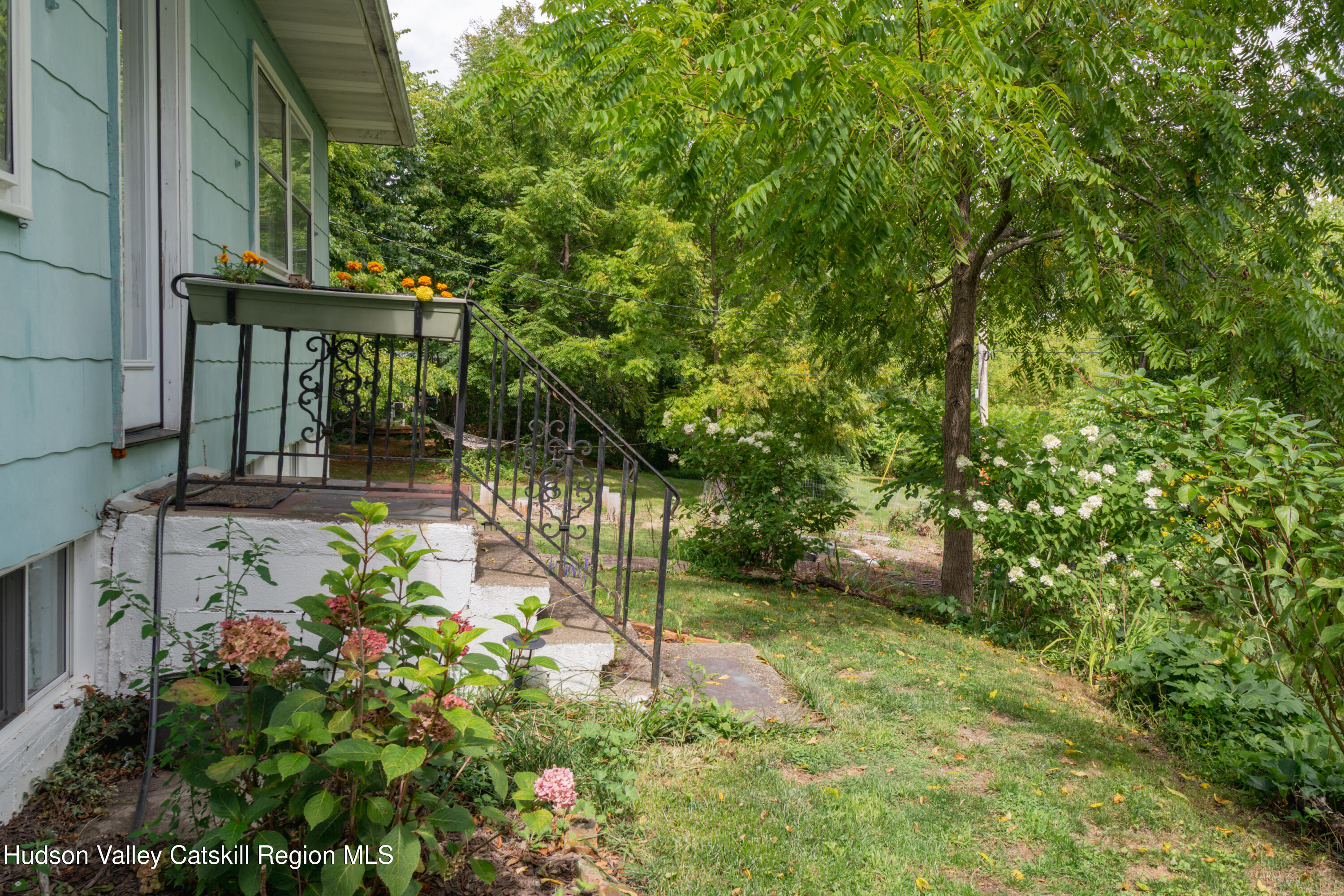 99 Spoorenburgh Road Athens, NY 12015 - Photo 32 of 39 a view of a wooden house with a tree