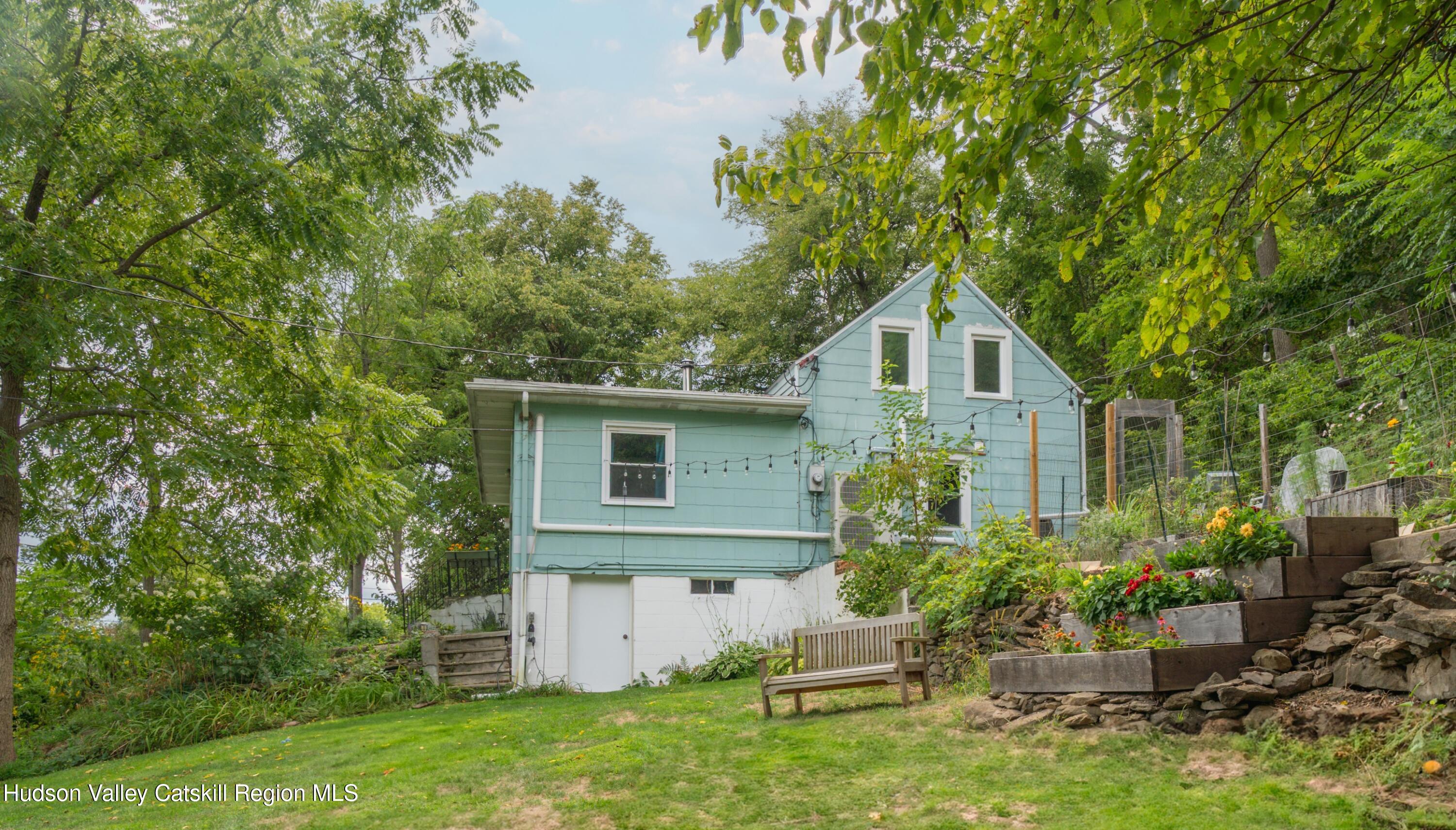 99 Spoorenburgh Road Athens, NY 12015 - Photo 34 of 39 a front view of house with yard and trees around