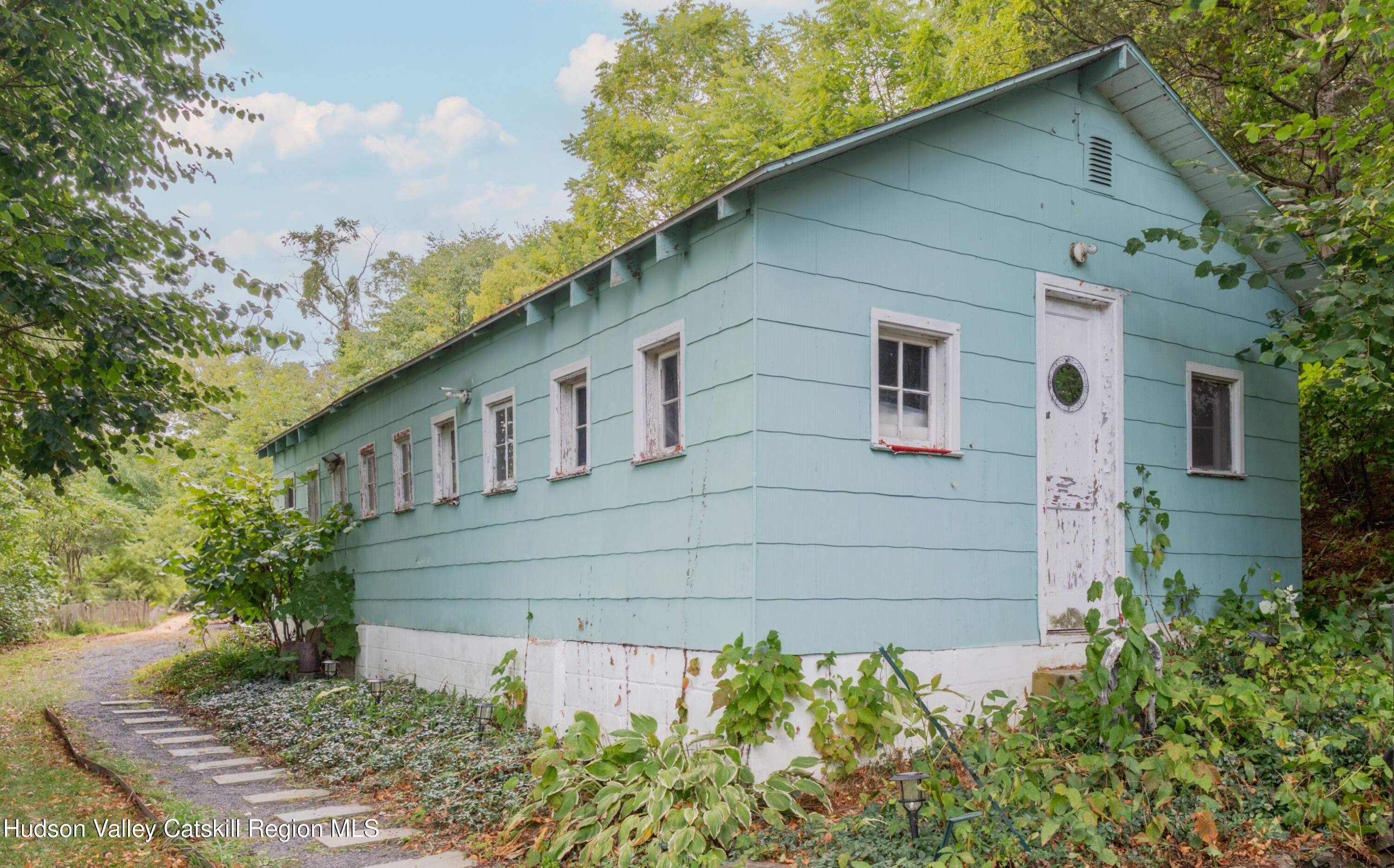 99 Spoorenburgh Road Athens, NY 12015 - Photo 35 of 39 a front view of a house with garden
