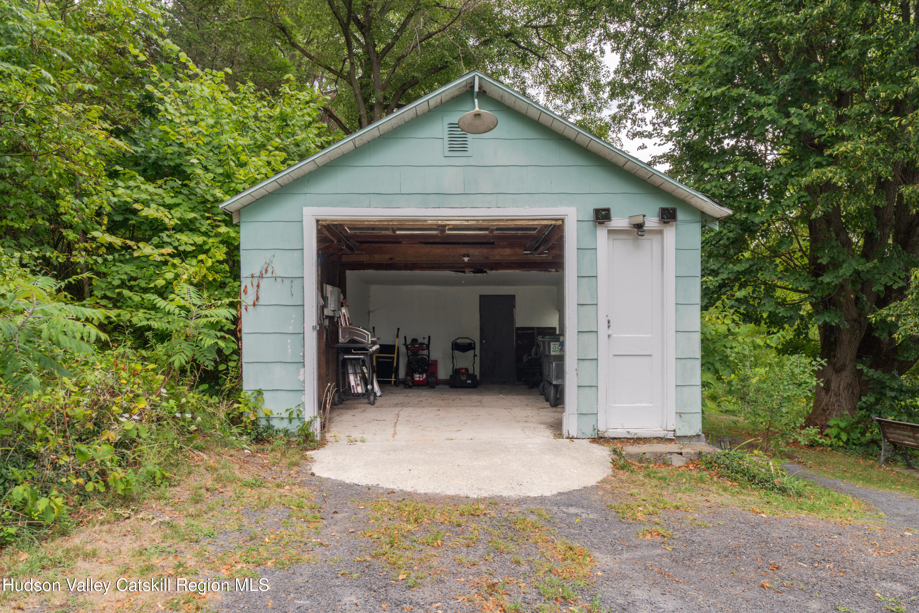99 Spoorenburgh Road Athens, NY 12015 - Photo 37 of 39 a view of a wooden house with a small yard
