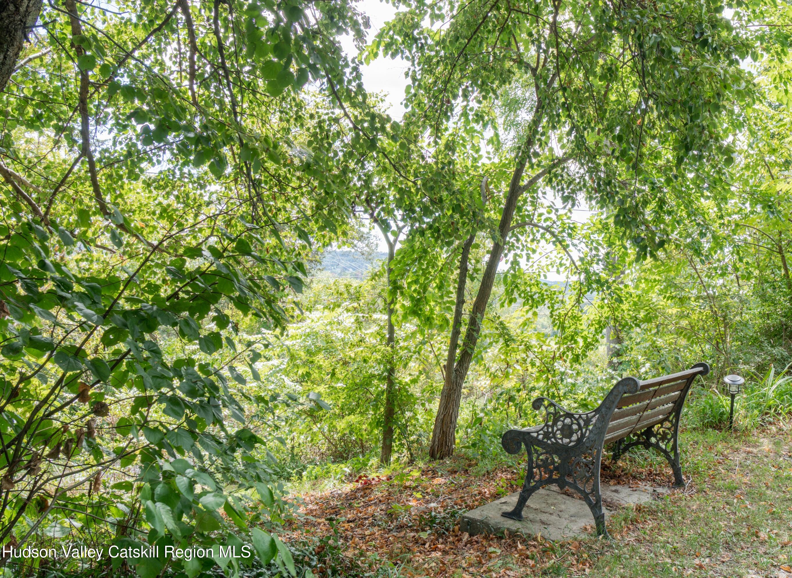 99 Spoorenburgh Road Athens, NY 12015 - Photo 5 of 39 a backyard of a house with table and chairs