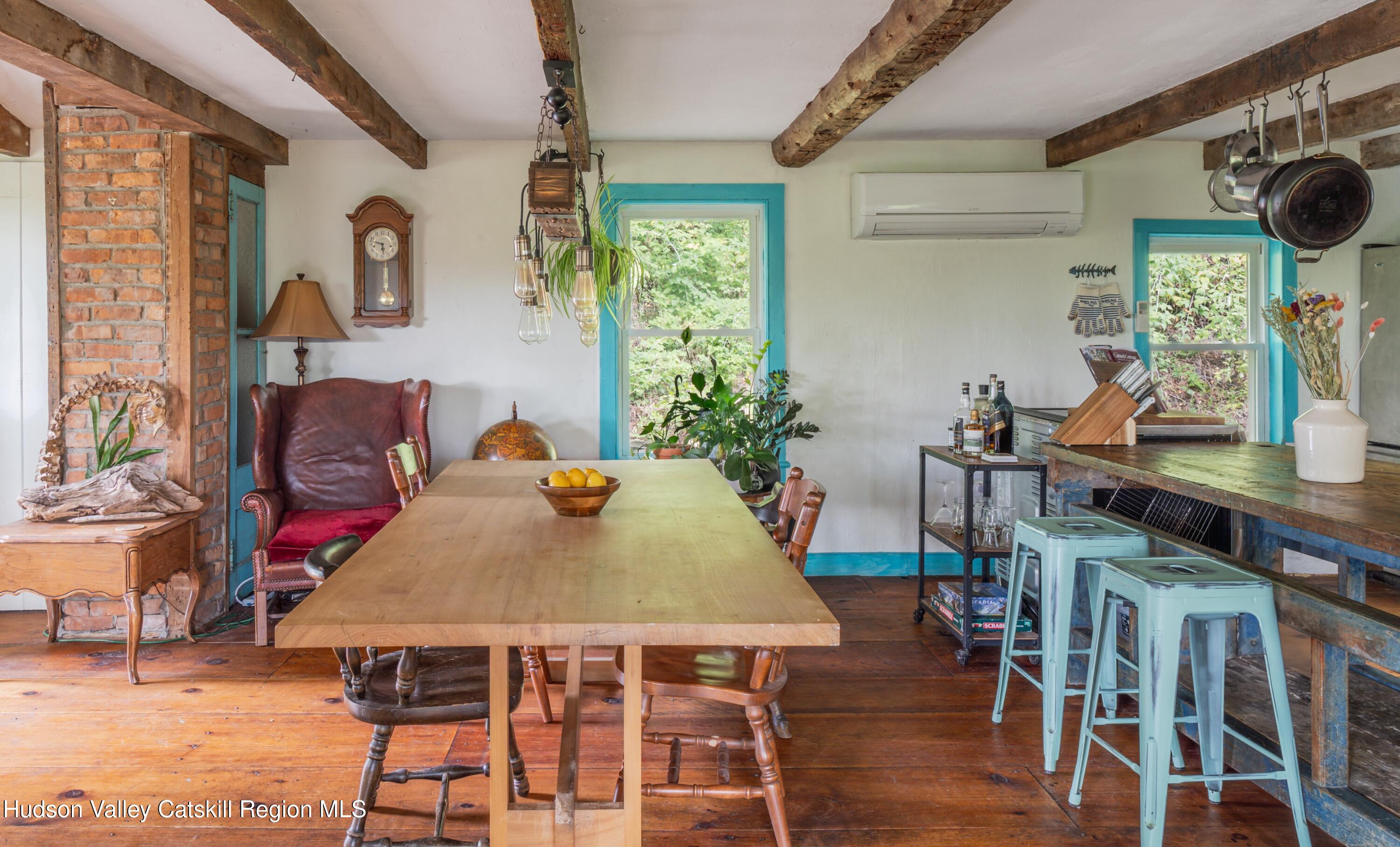 99 Spoorenburgh Road Athens, NY 12015 - Photo 8 of 39 a view of a dining room with furniture window and wooden floor