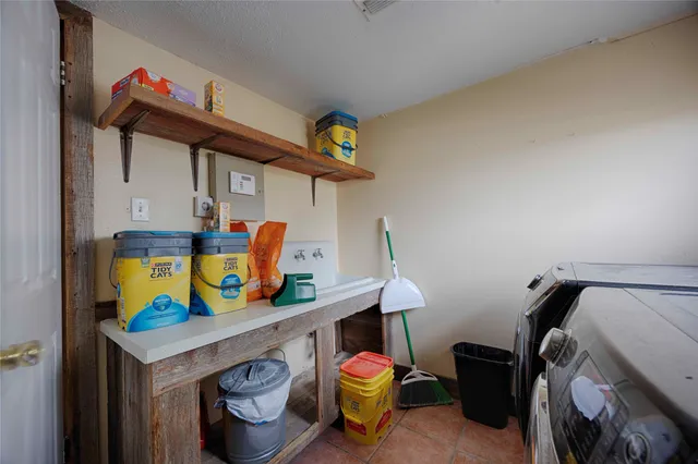 a large bed sitting in a bedroom next to a window