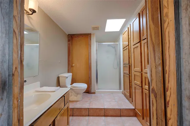 an aerial view of a house with outdoor space