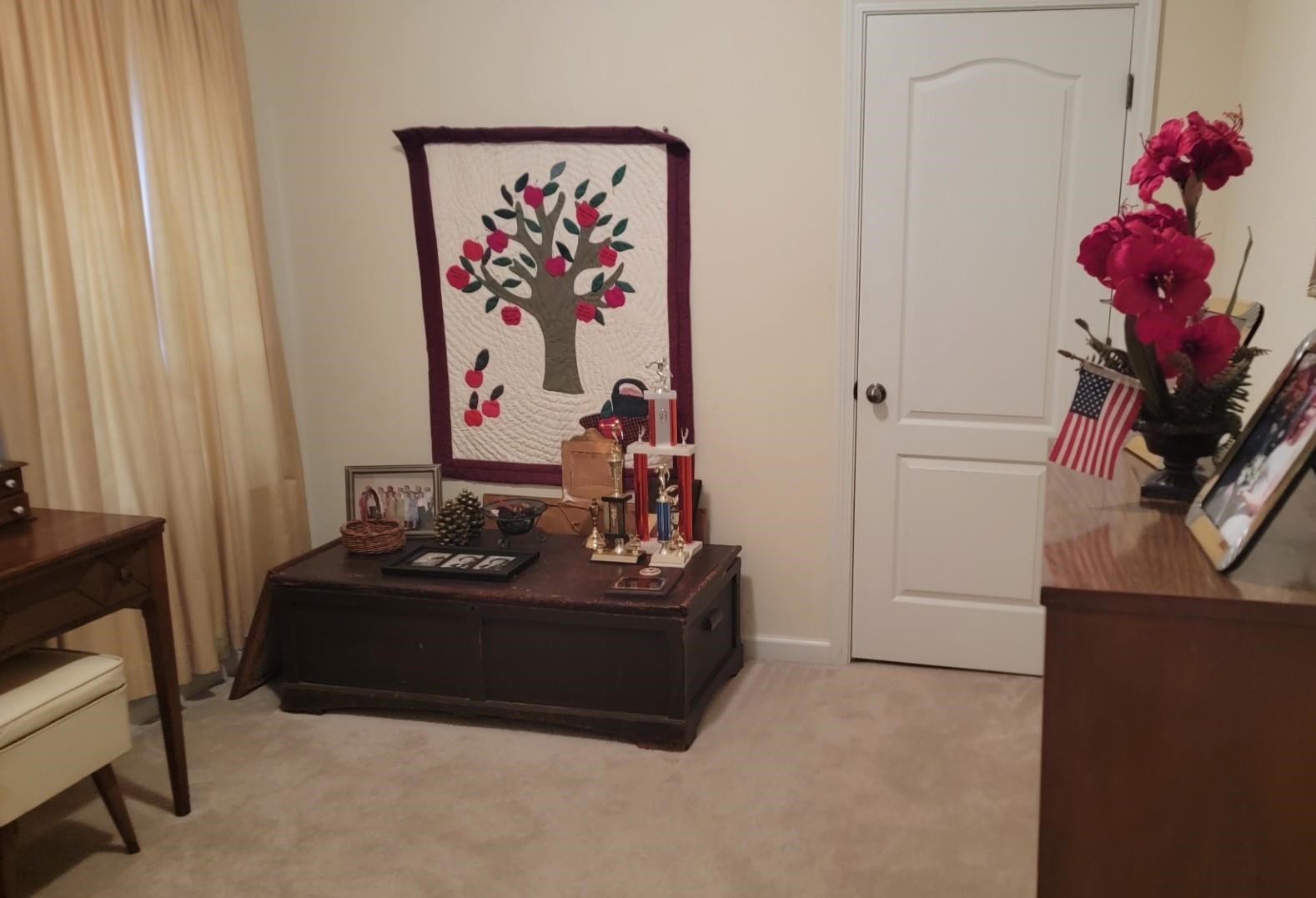 1017 Milano Cove Memphis, TN 38018 - Photo 16 of 20 a living room with furniture and a potted plant