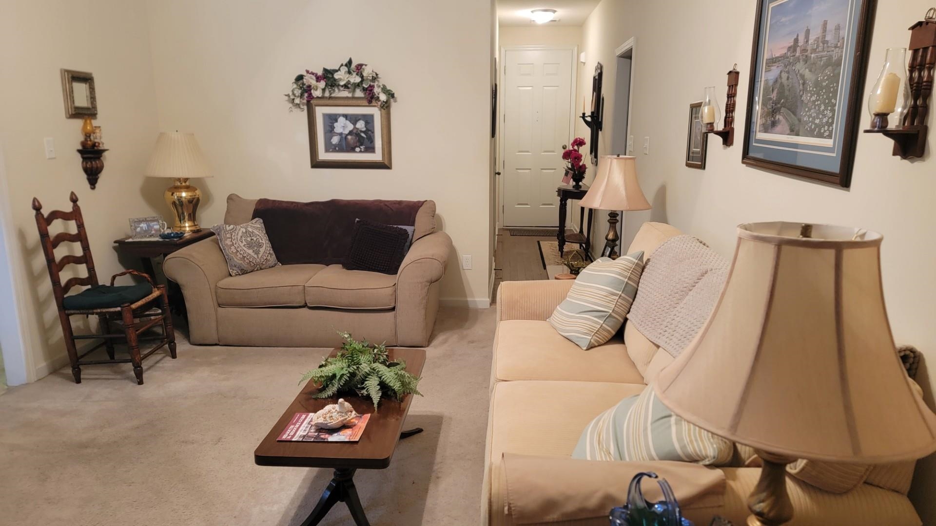 1017 Milano Cove Memphis, TN 38018 - Photo 4 of 20 a living room with furniture and a mirror