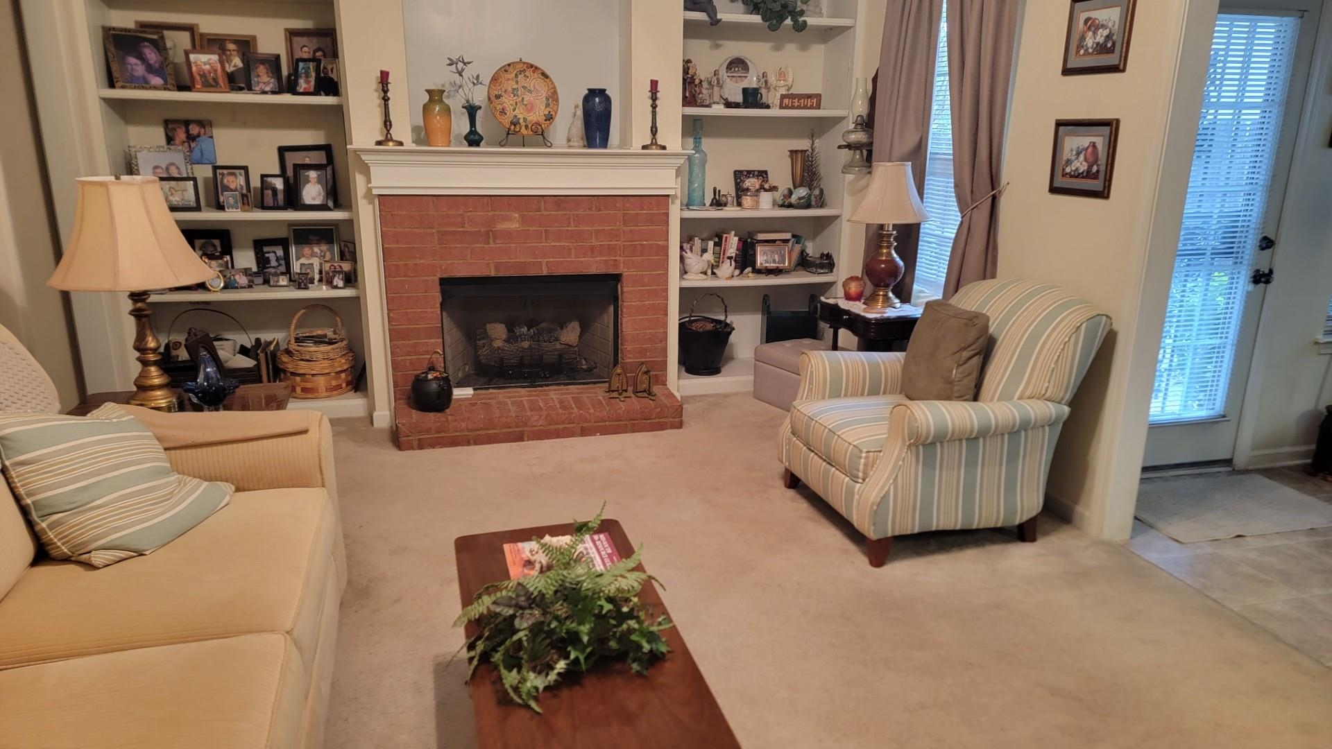 1017 Milano Cove Memphis, TN 38018 - Photo 5 of 20 a living room with furniture and a fireplace