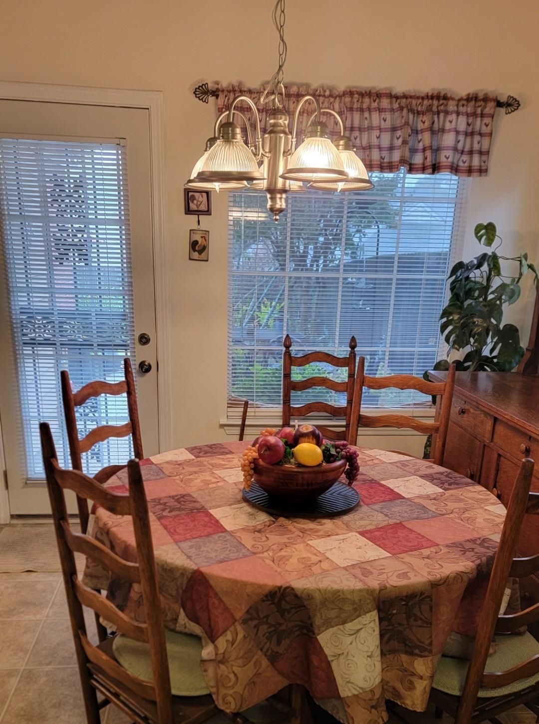 1017 Milano Cove Memphis, TN 38018 - Photo 9 of 20 a view of a dining room with furniture and chandelier