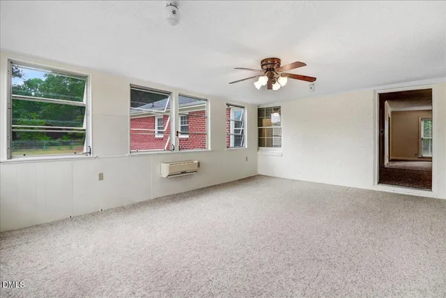 a view of an empty room with a window